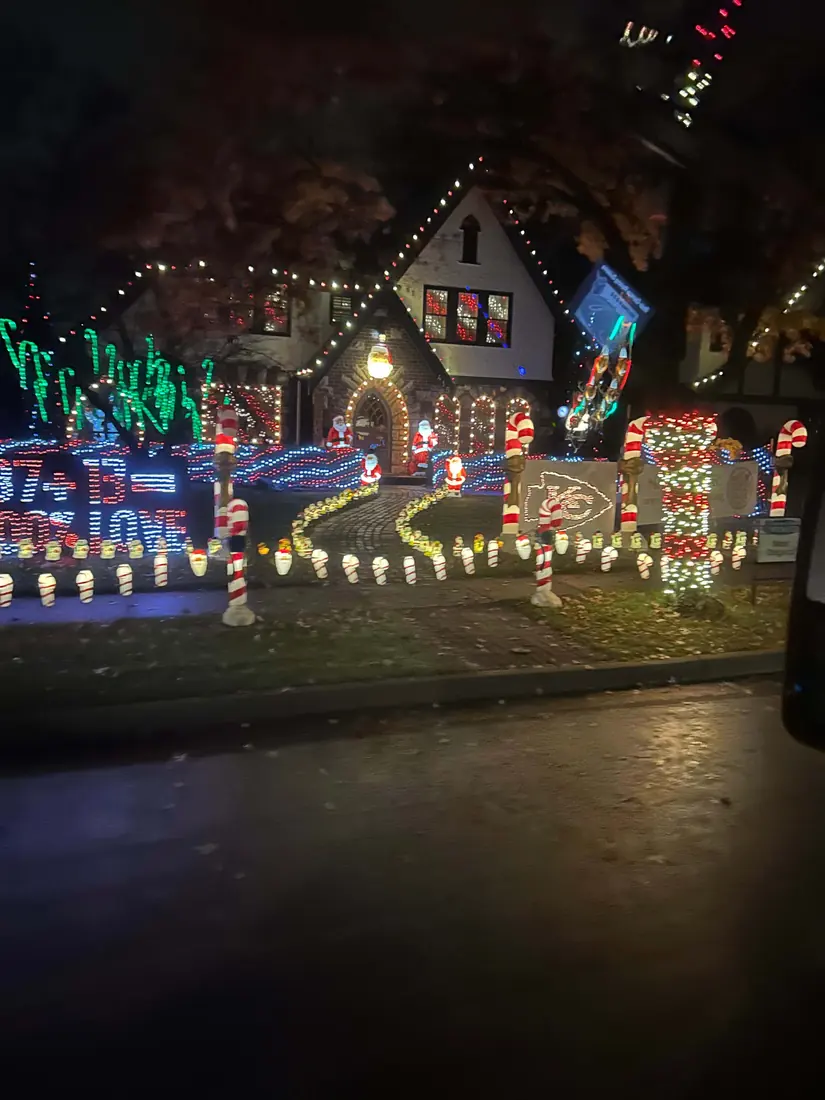 A Kansas City house lined with candy canes and holiday lights